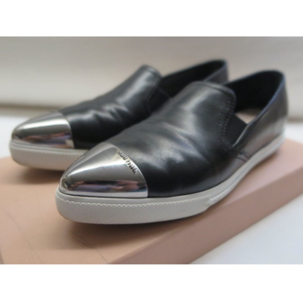 Miu Miu Metal Cap Black Leather Slip-On Sneakers